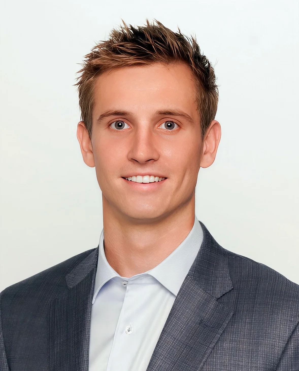 Ryan Parker, Realtor with Coldwell Banker Realty in Boca Raton, wearing a grey blazer