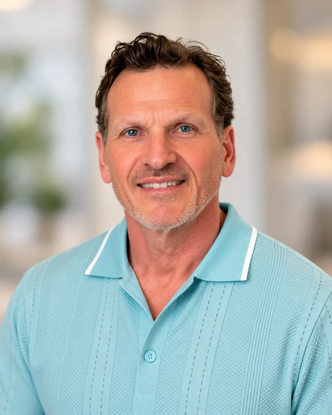 Curt Simmons, Snohomish County real estate broker, wearing a light blue polo shirt