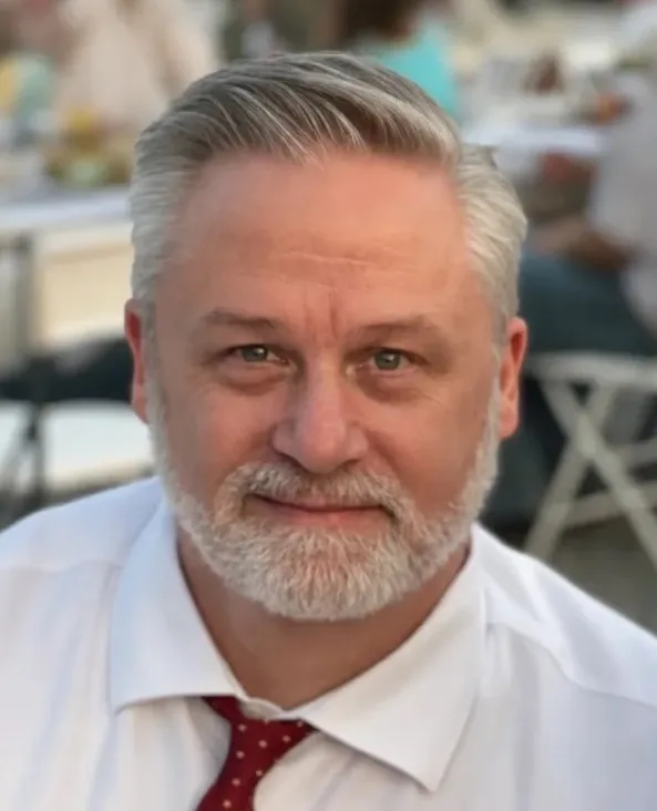 Professional headshot of Paul Knighton, Associate Managing Broker/Owner at MORE Realty