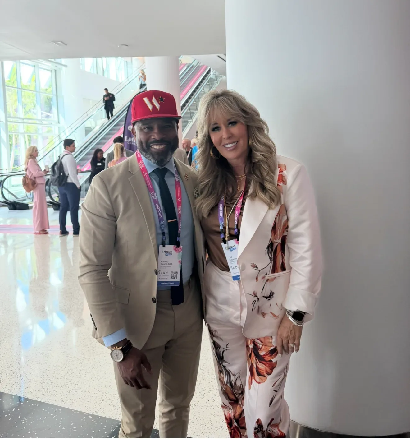 Lisa Copeland with a colleague at a conference wearing event badges