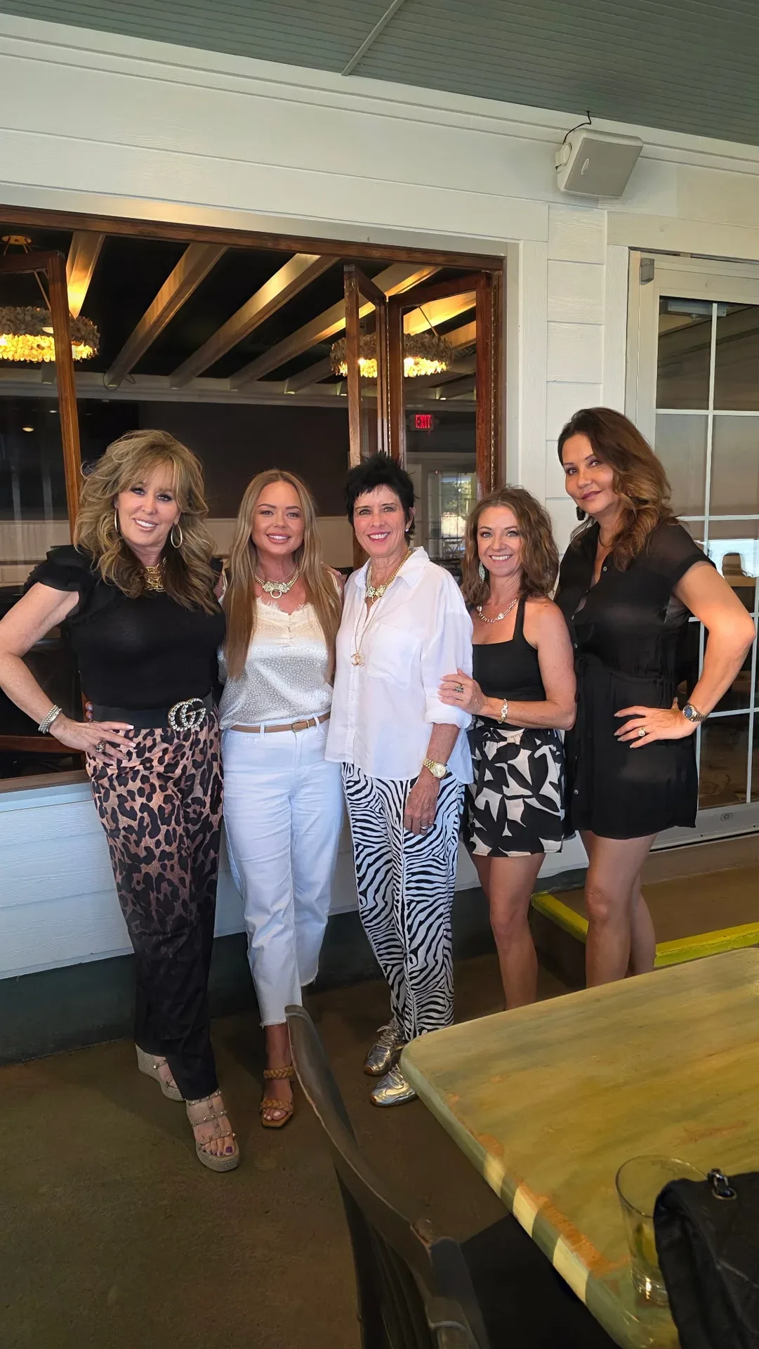 Lisa Copeland with a group of five women standing together at an indoor social event
