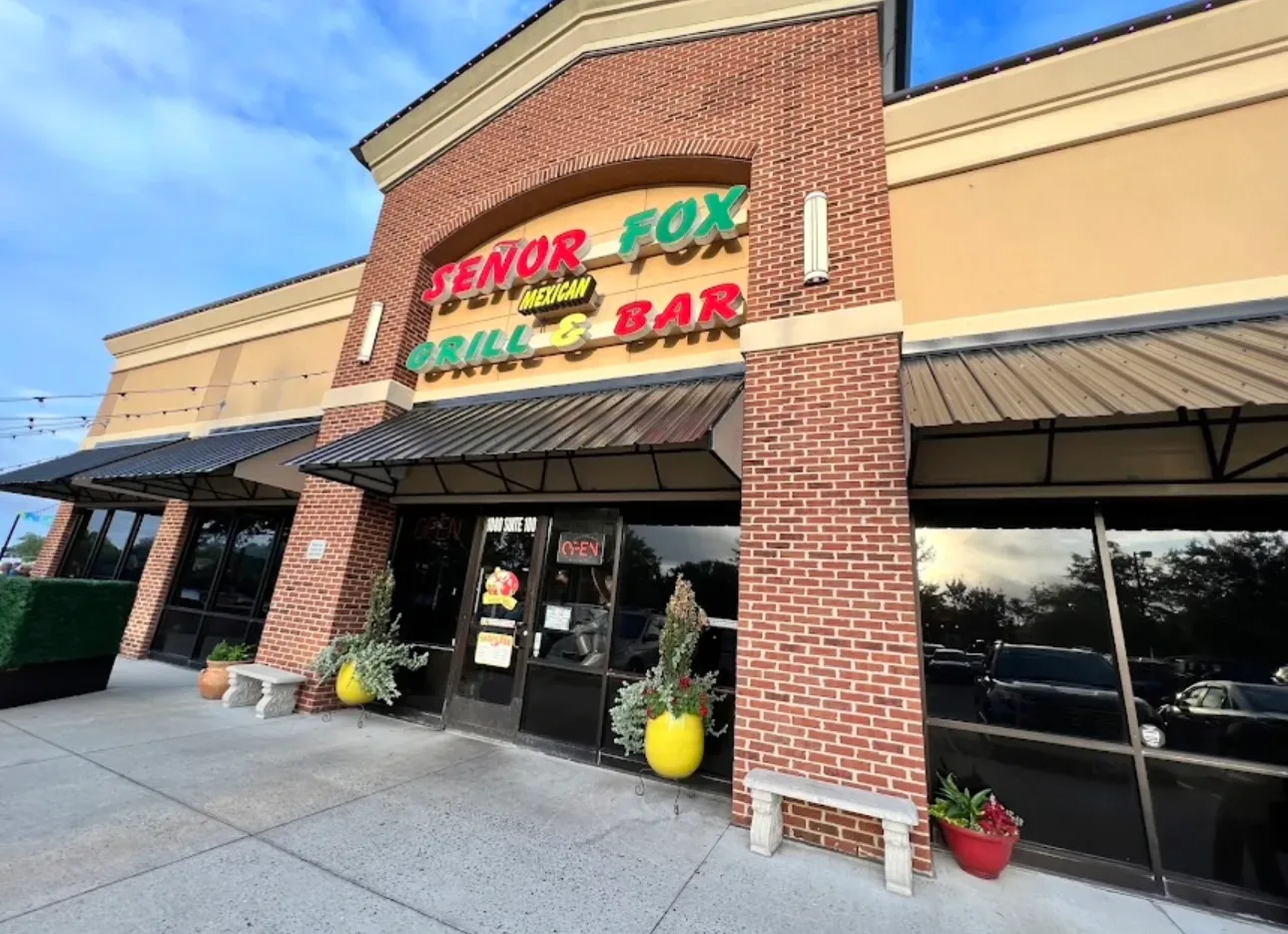 Street-level view of the Señor Fox Mexican Grill and Bar exterior with a brick facade on Nimmo Parkway in Virginia Beach