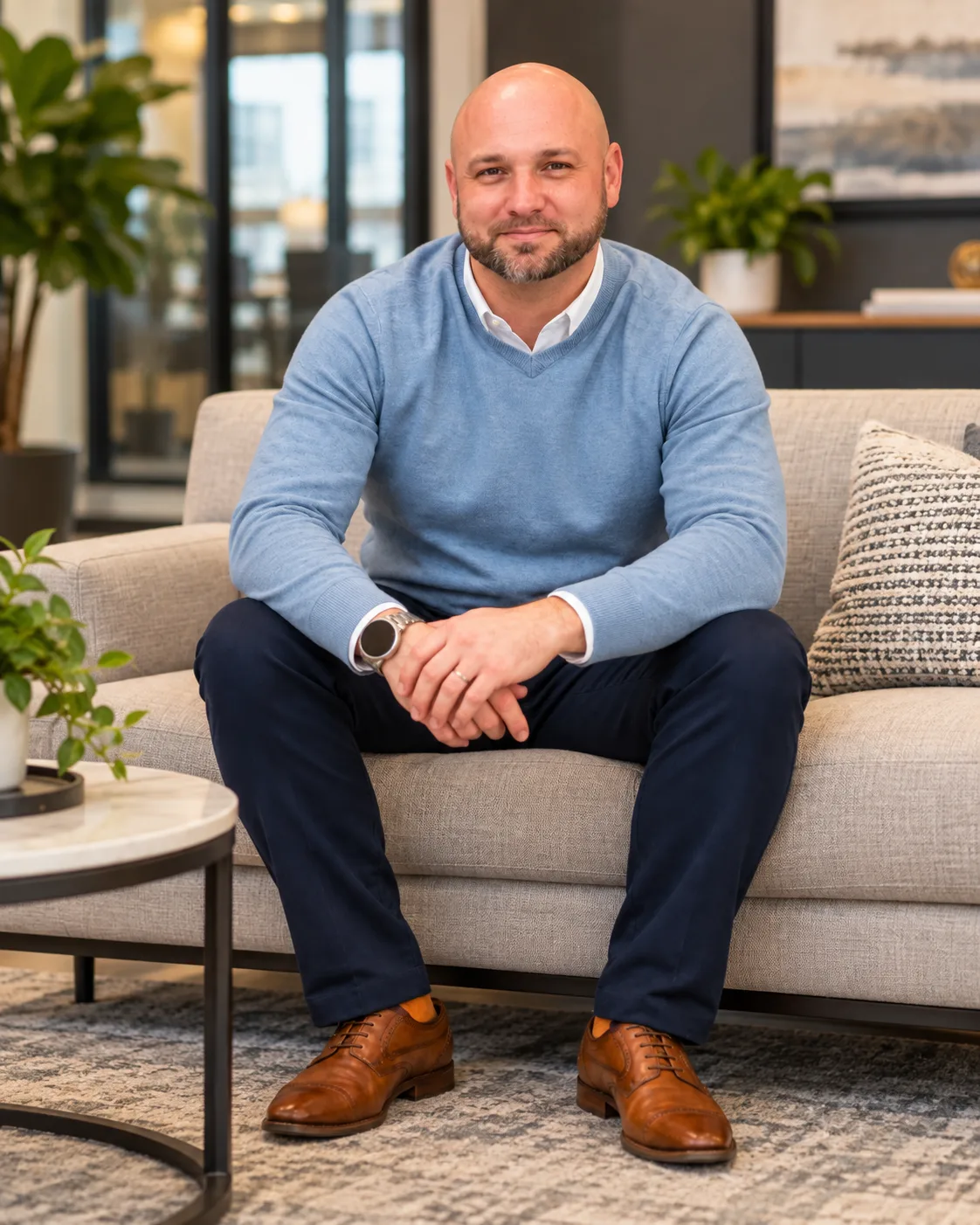 William "Brandon" Spinner, Broker-Salesperson and team leader, in a navy blazer