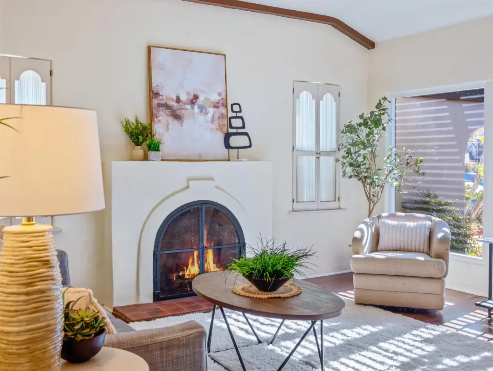 A cozy, stylish living room with a fireplace, the kind of welcoming space a family inherits