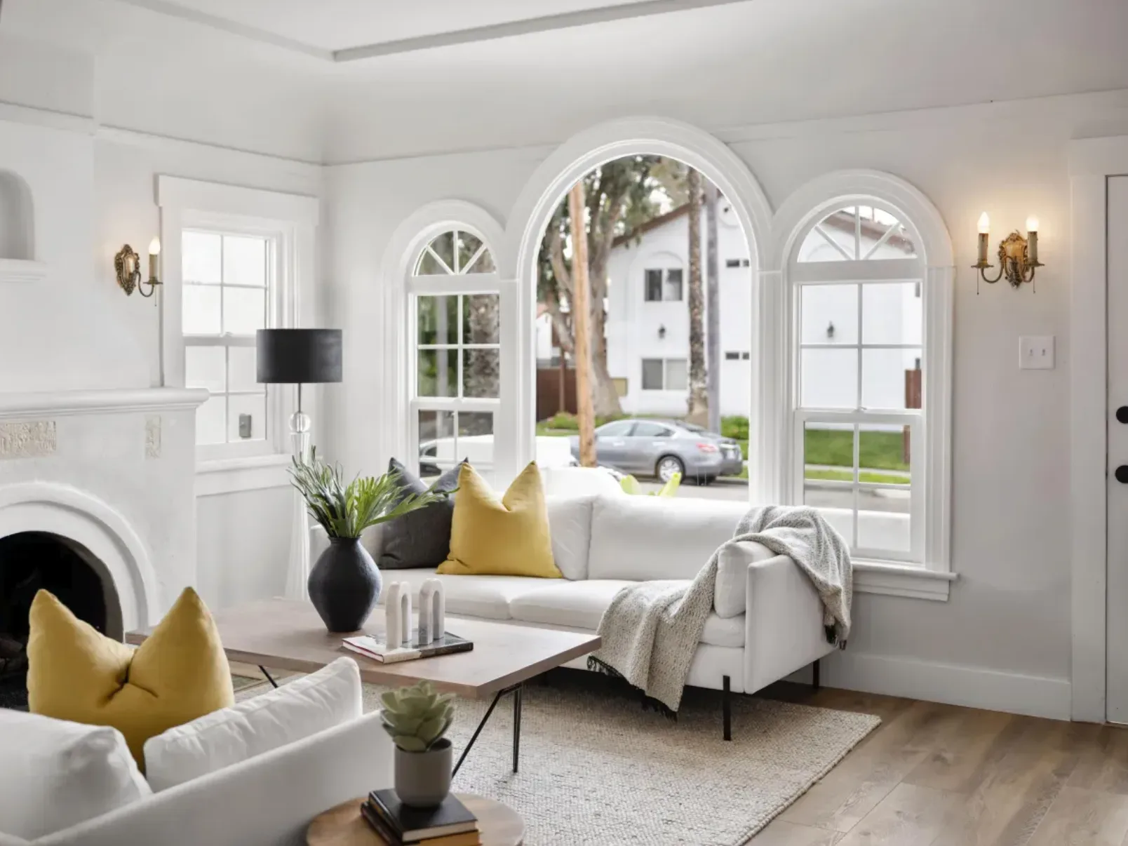 A bright, modern living room with arched windows, the calm of a right-sized home