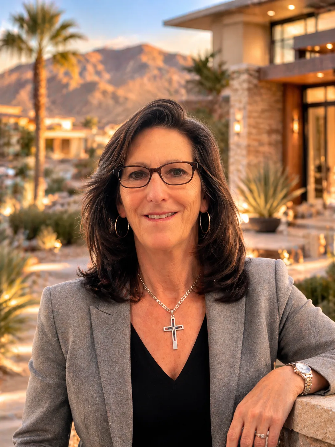 Sandy Margolin, Las Vegas Realtor, wearing a grey blazer and glasses