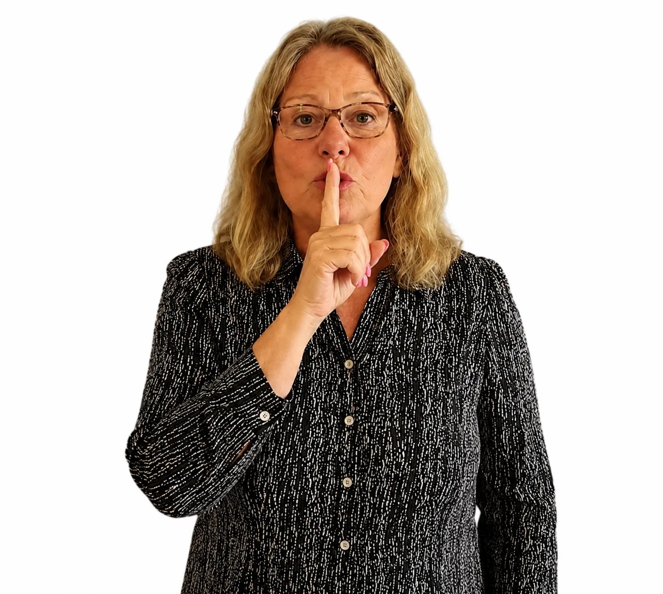 A woman holding a finger to her lips in a quiet gesture against a white background