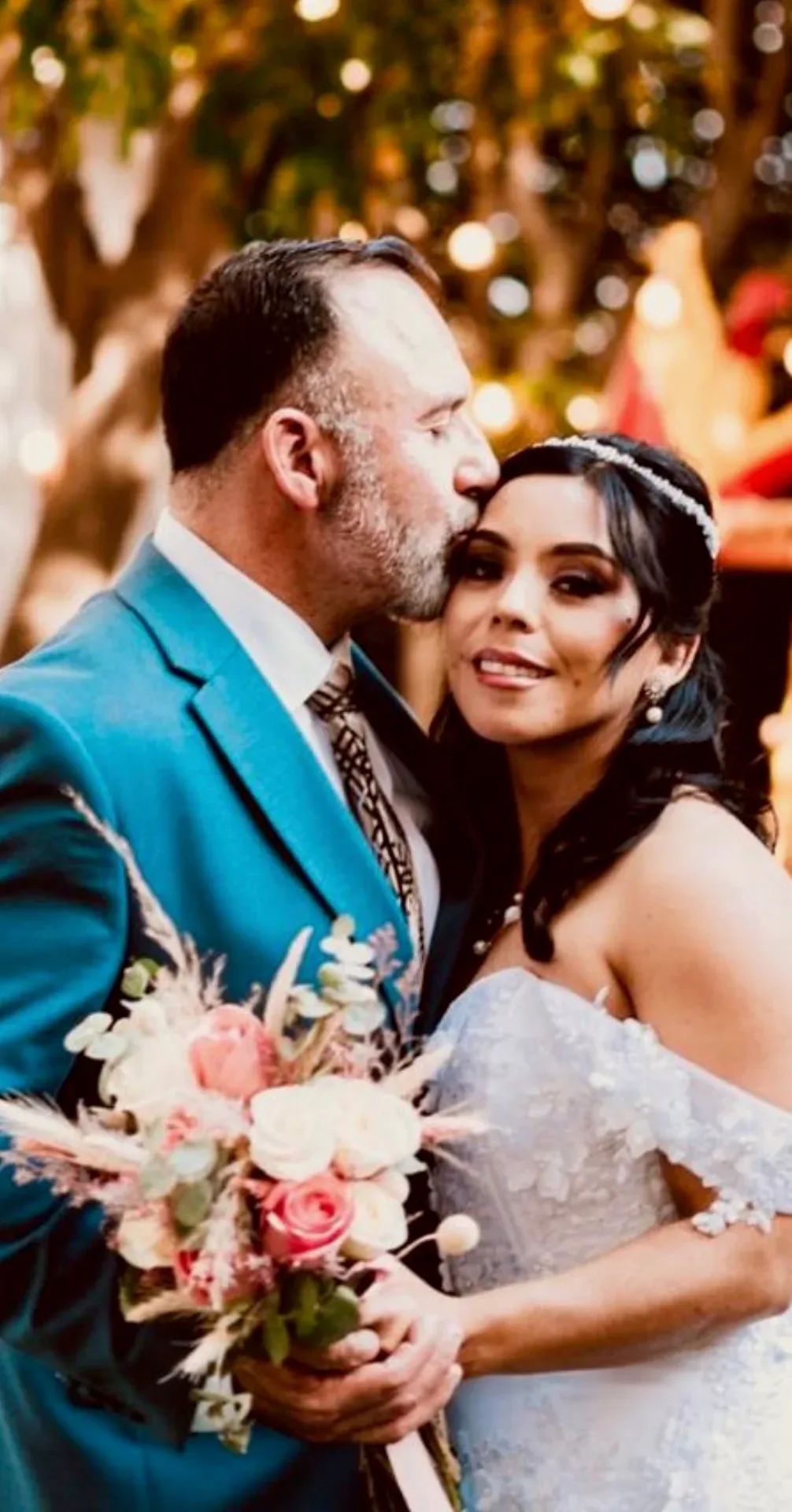 Miguel kissing Julissa on their wedding day