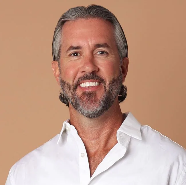 Russell O'Brien, REALTOR with One Path Realty, in a white collared shirt