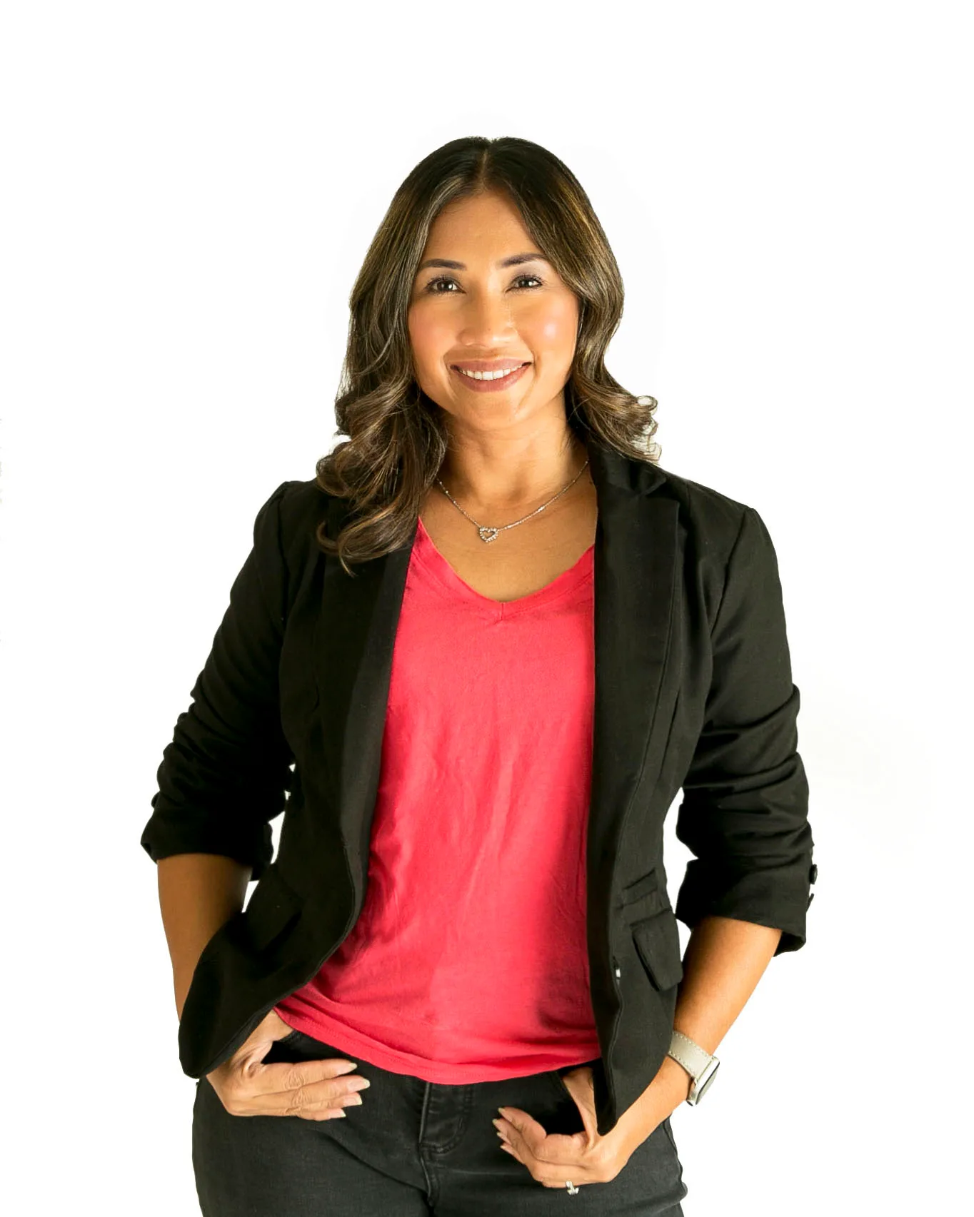 Phyllis Domingo smiling in a black blazer over a bright pink top