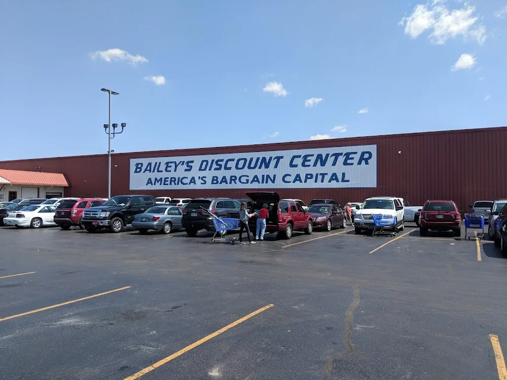 Shoppers loading their vehicles at Bailey's Discount Center