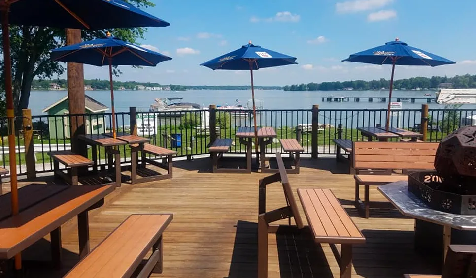 The Bugaboo’s deck with picnic tables and a lake view