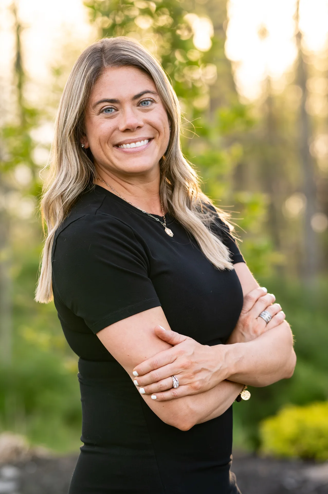 LeaAnn Taylor, community guide author and local Realtor, smiling with arms crossed