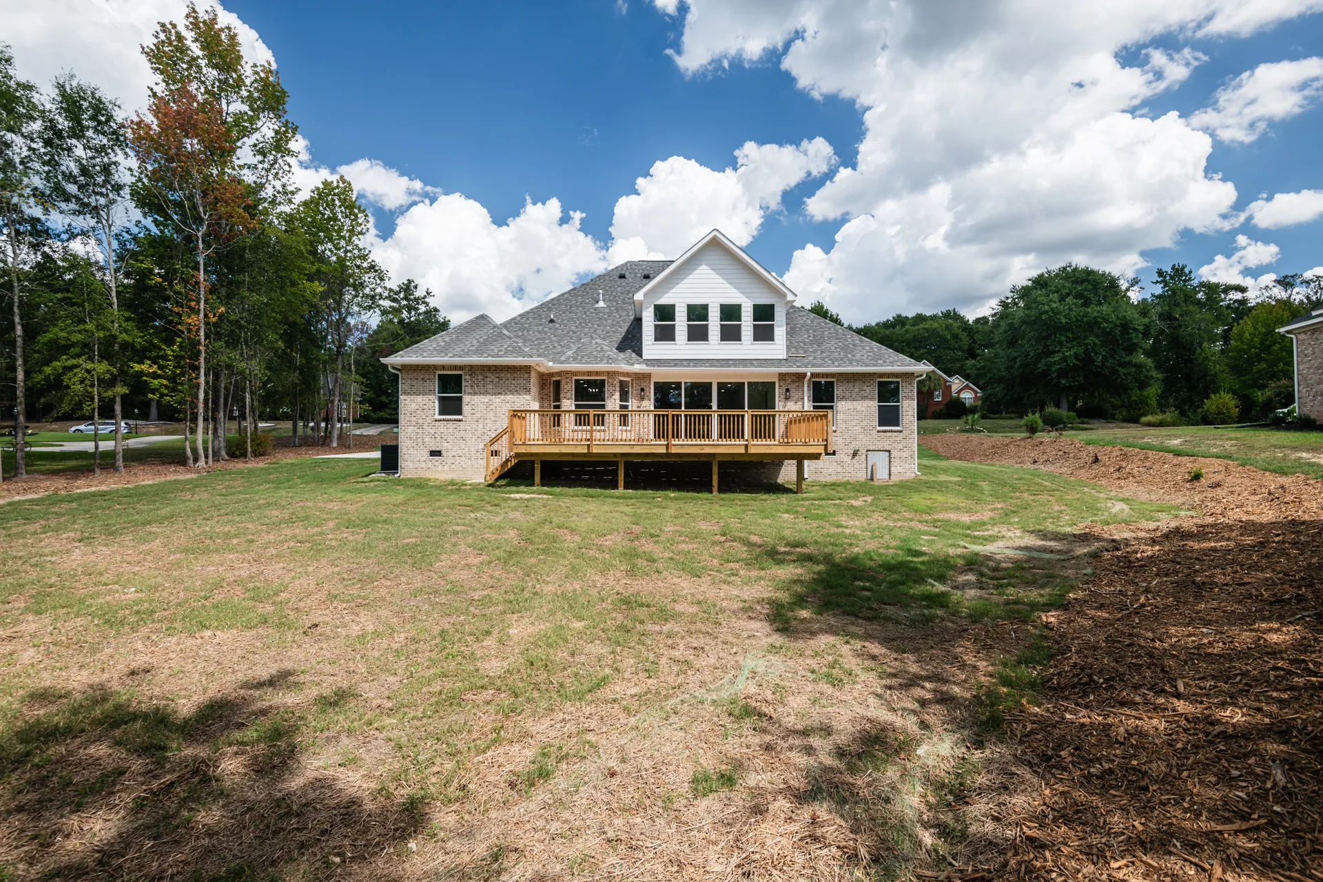 Back yard and deck overlooking the .79-acre lot