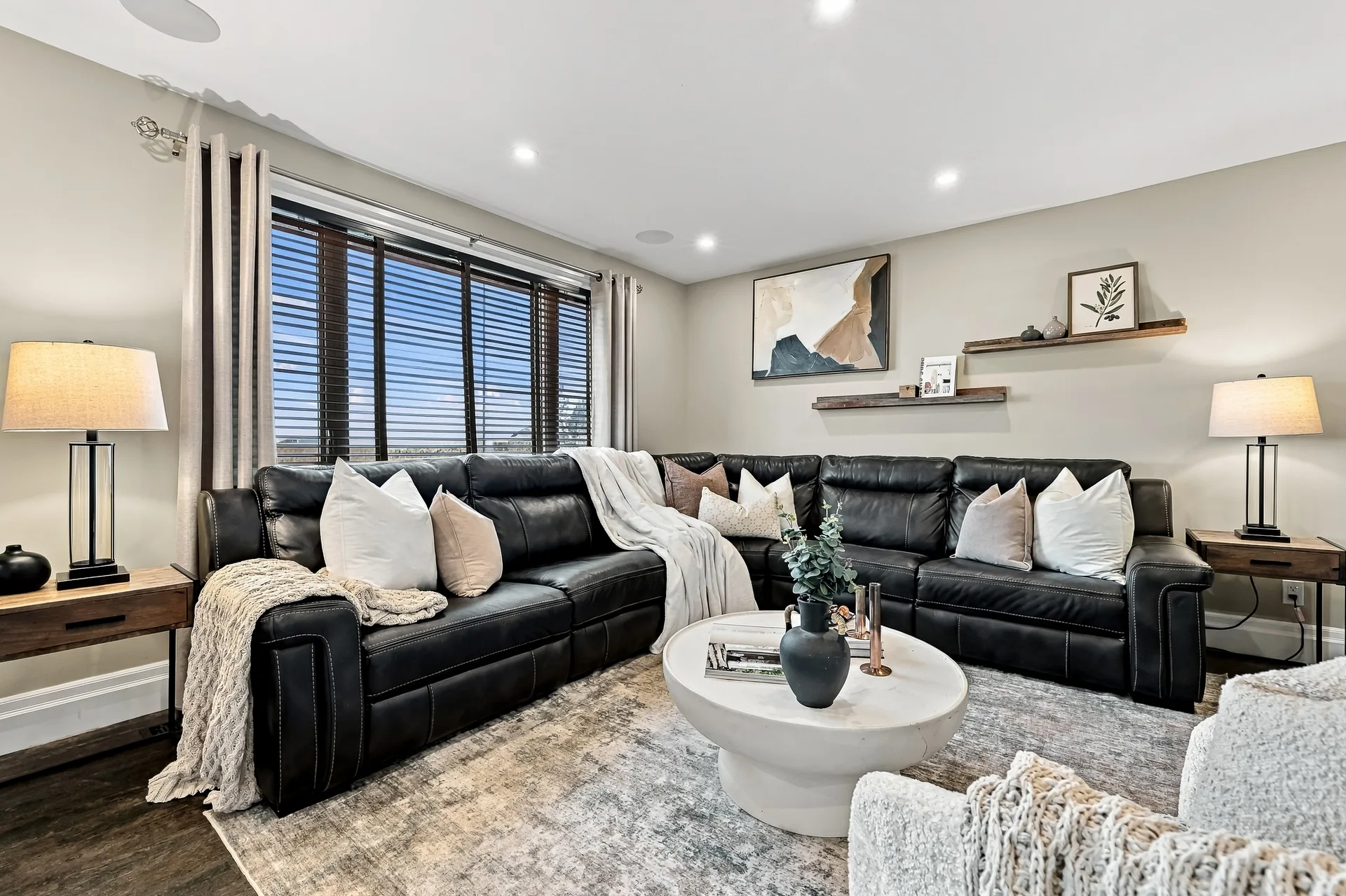Living room with large sectional and windows on two sides