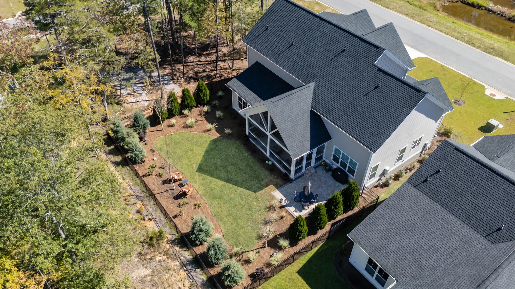 Aerial view of the backyard, patio, and porch