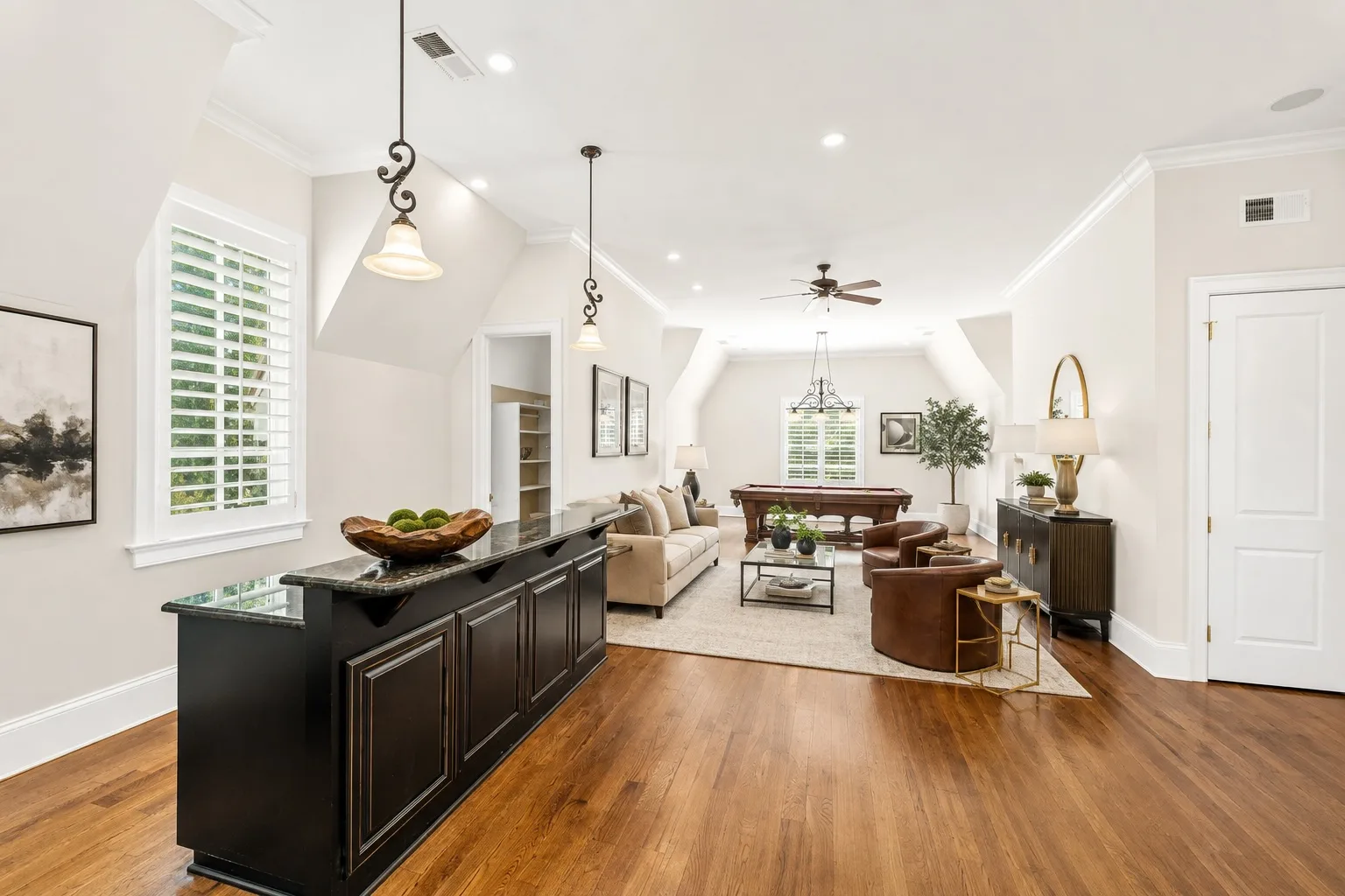 Living area with wet bar and pool table