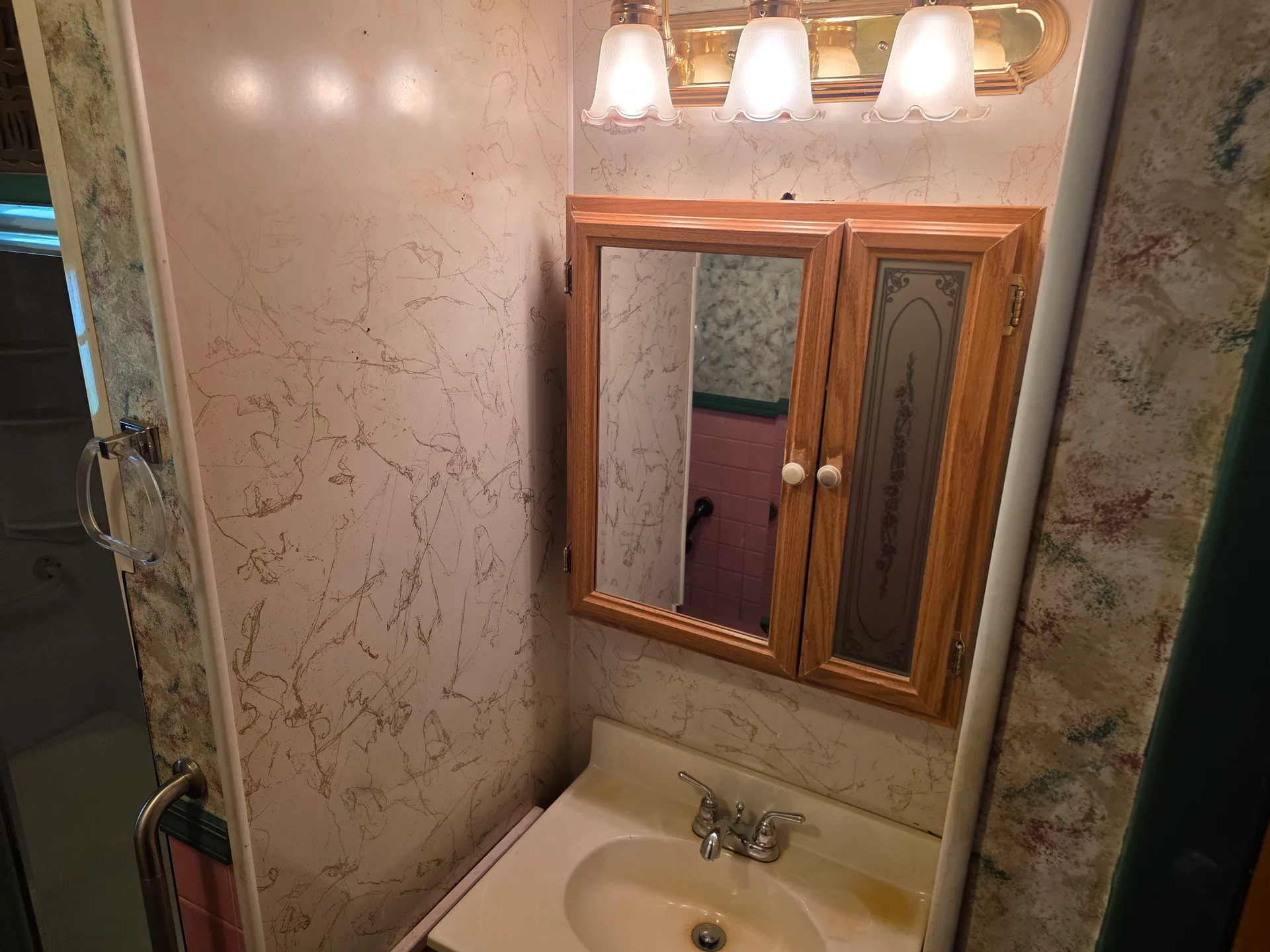 Bathroom vanity with medicine cabinet and light fixture