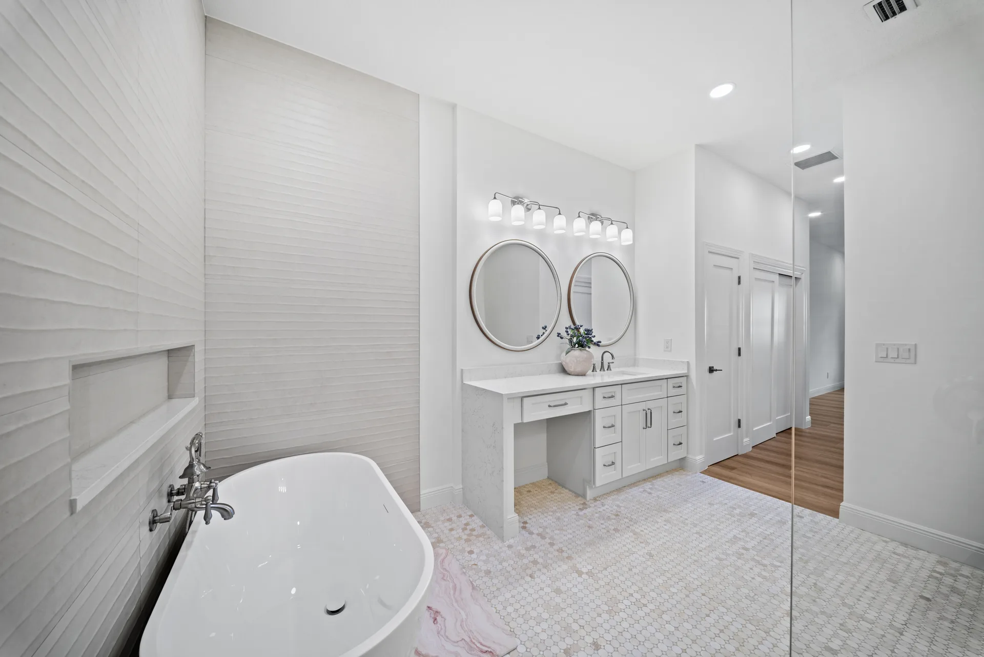 Primary bathroom vanity with accent wall tile