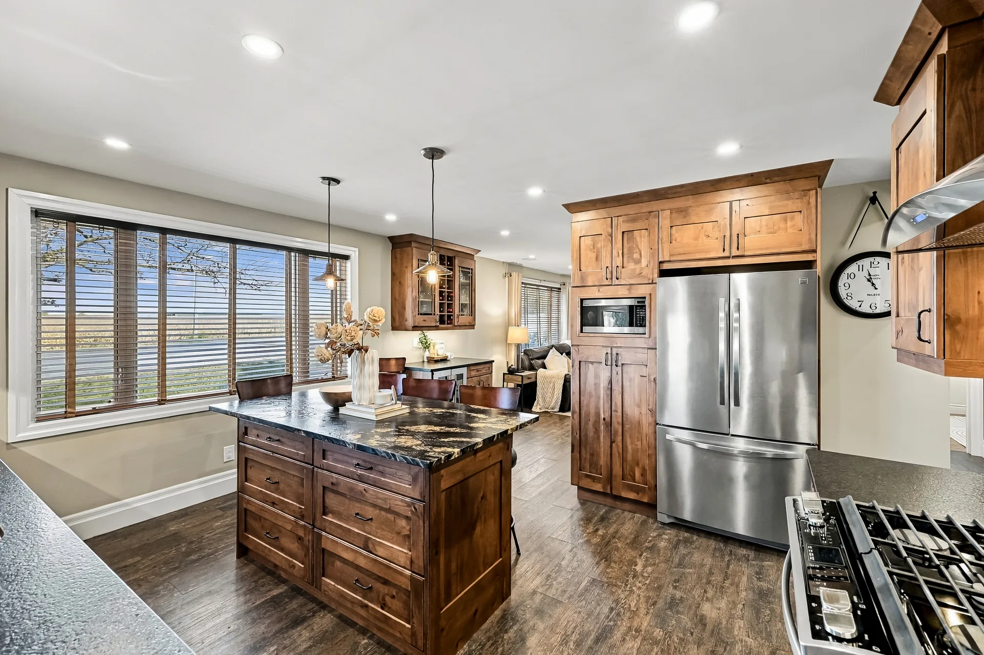 Kitchen island open to the living area with stainless appliances