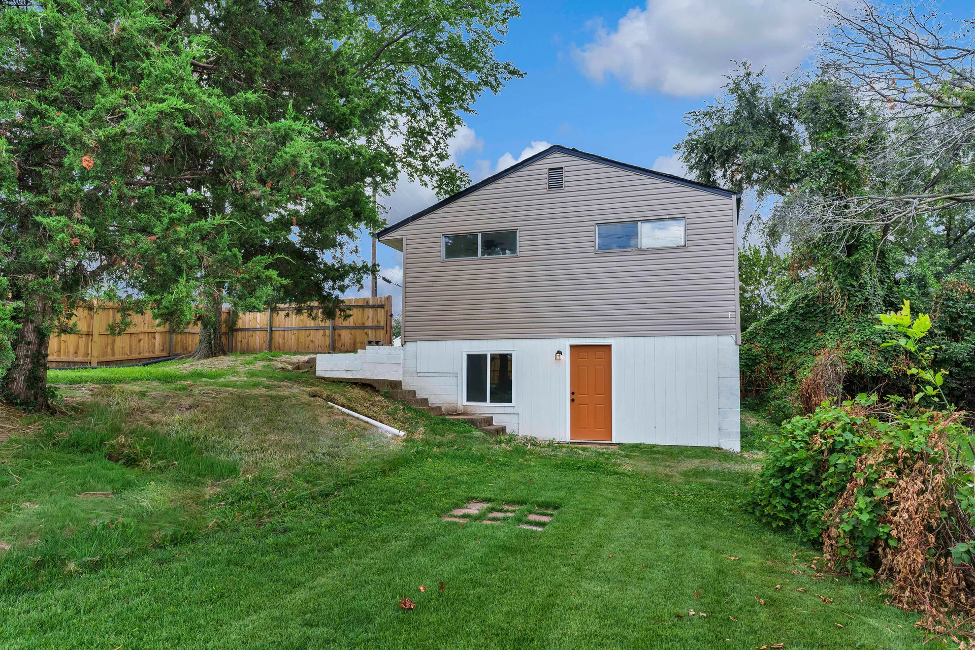 Rear exterior showing two-story split-level design