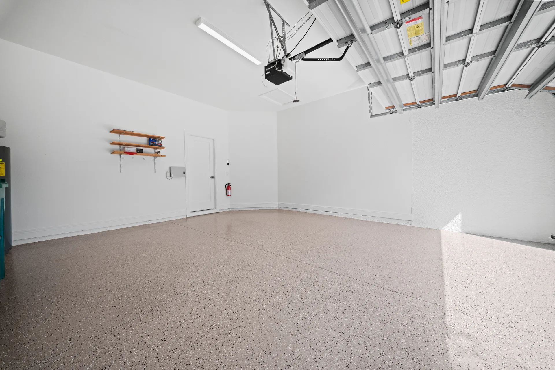 Clean two-car garage with epoxy-coated floor