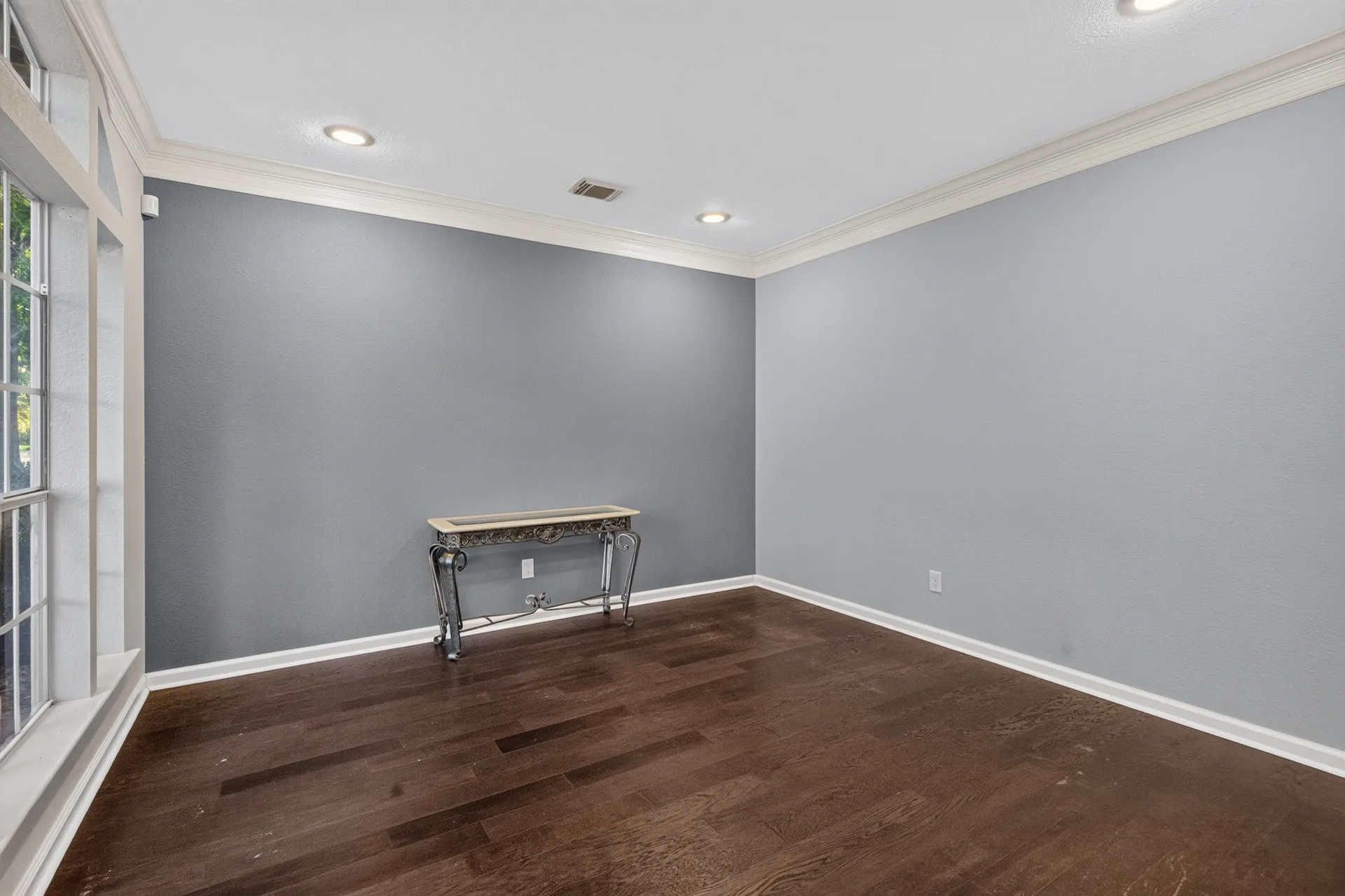 Front flex living room with crown molding and hardwood floors