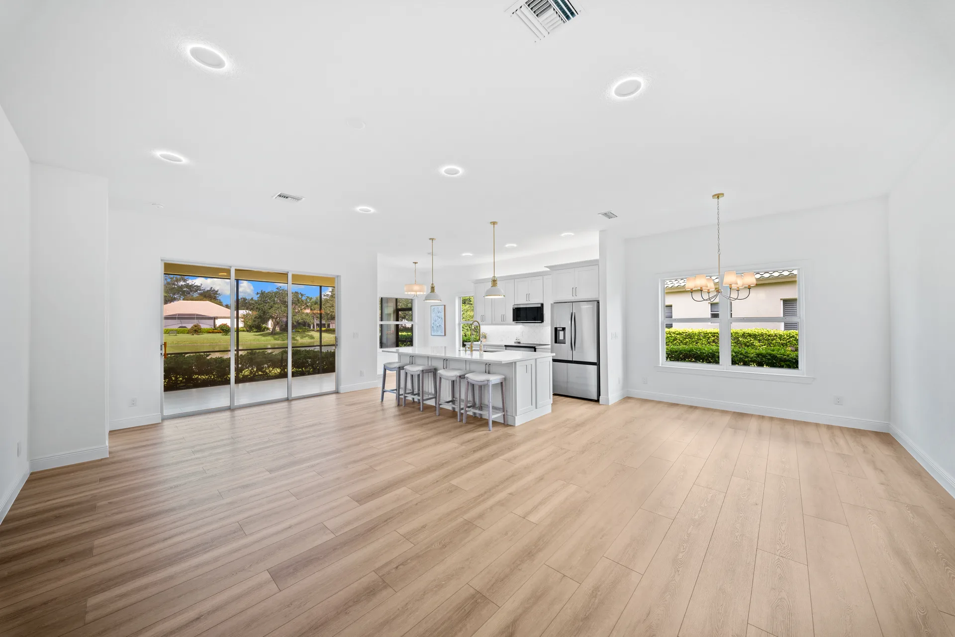 Wide-angle open-concept kitchen and living area