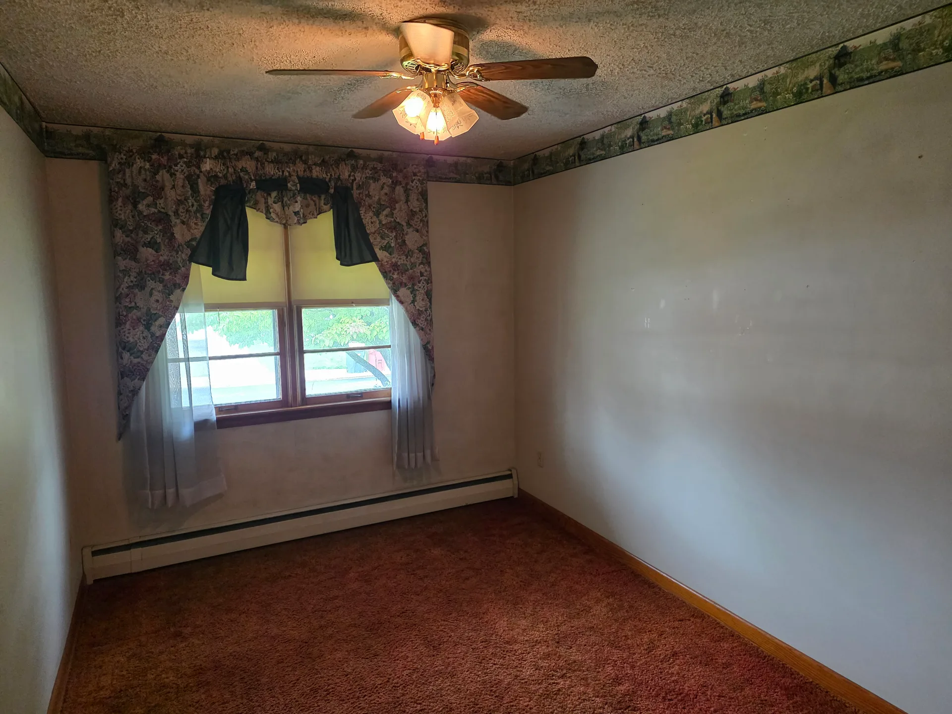 Bedroom with carpeted floors and light walls