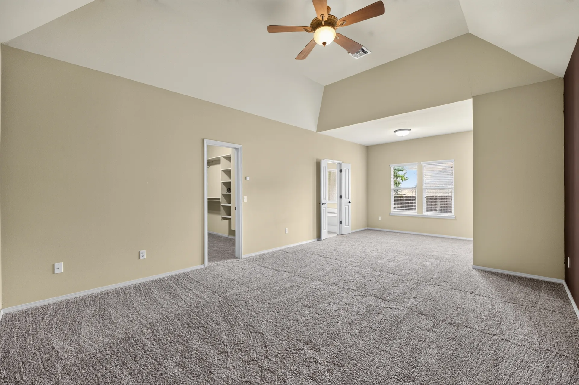 Primary suite with vaulted ceiling