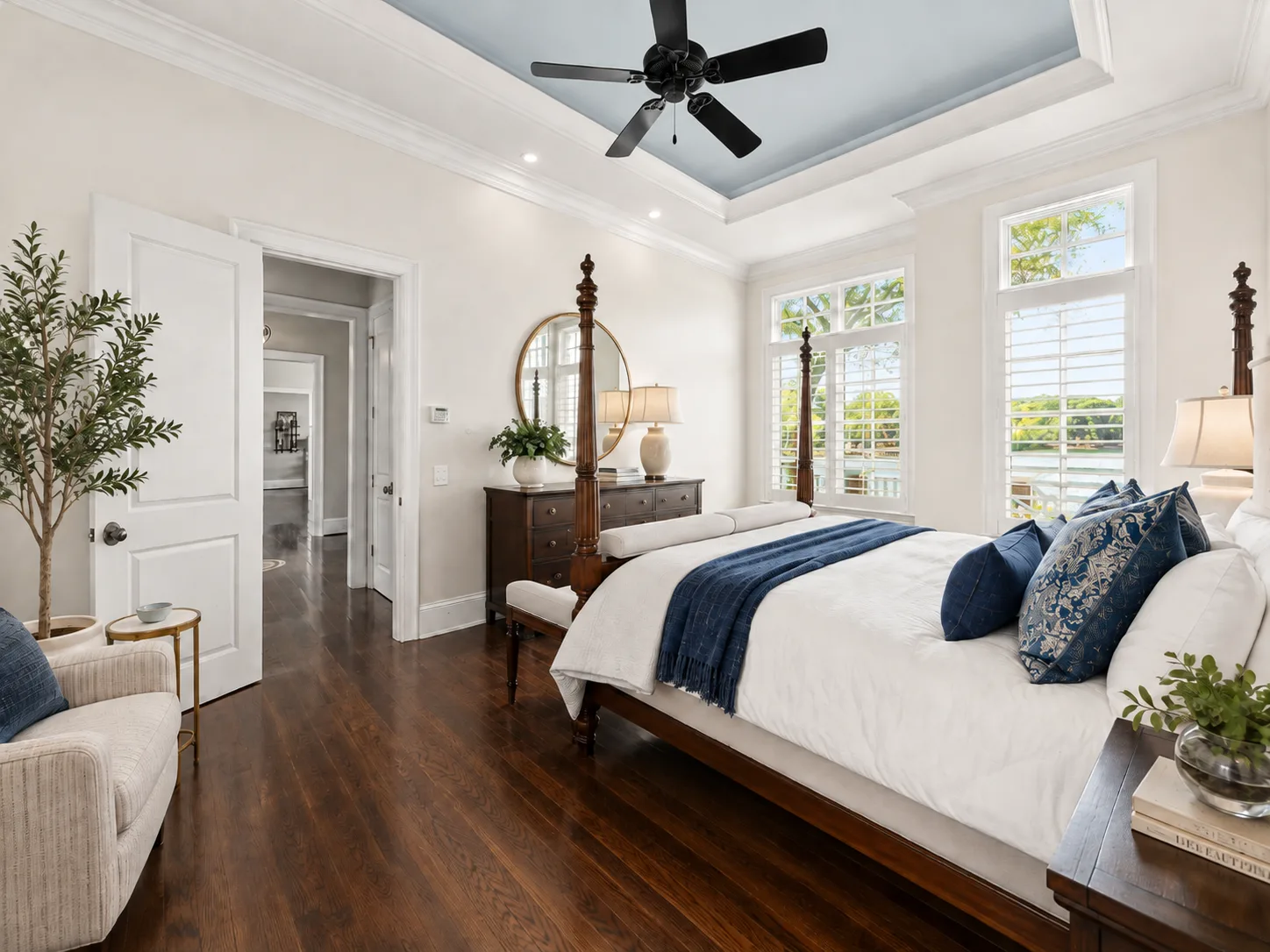 Master bedroom with tray ceiling and shutters