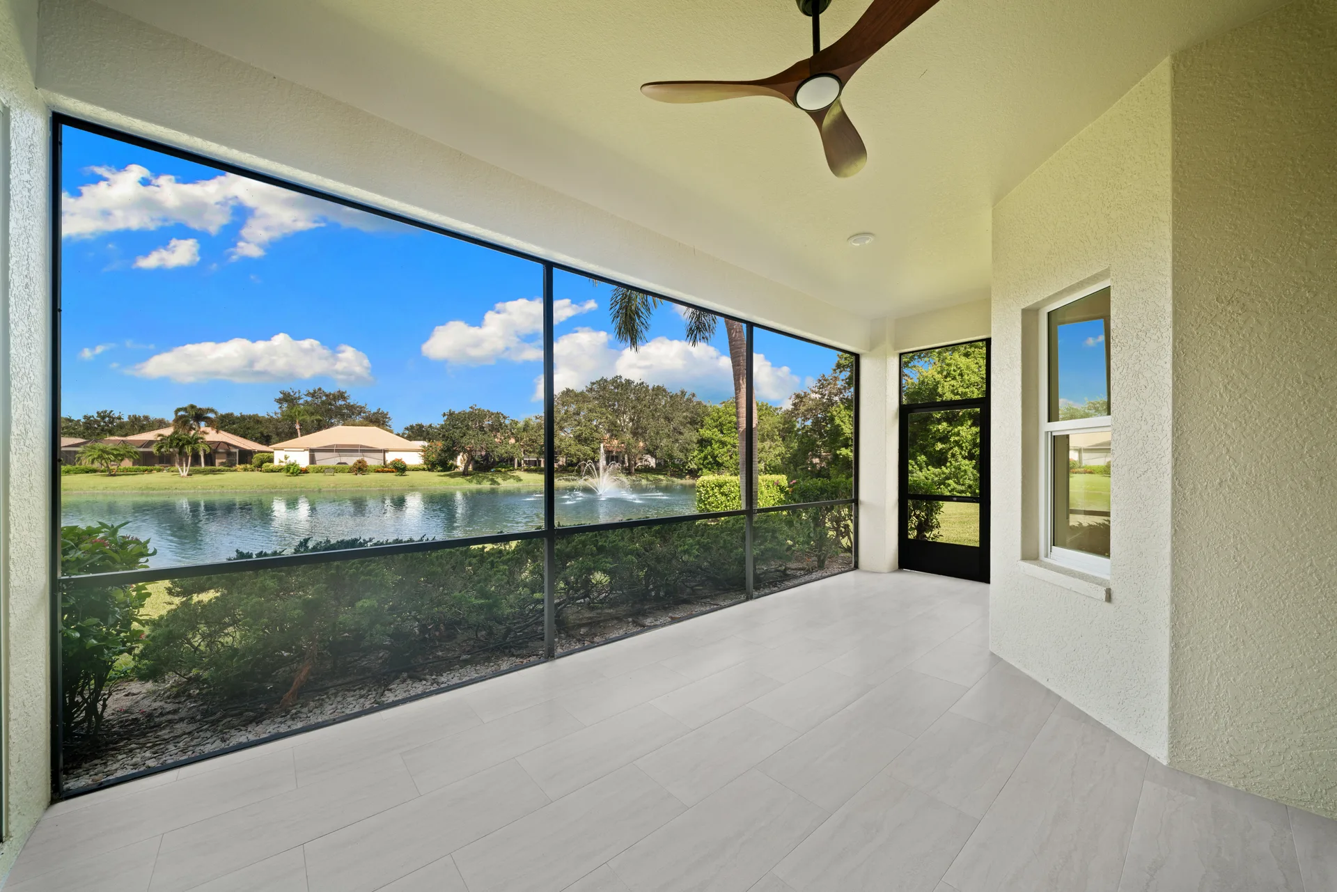 Screened-in lanai with modern ceiling fan