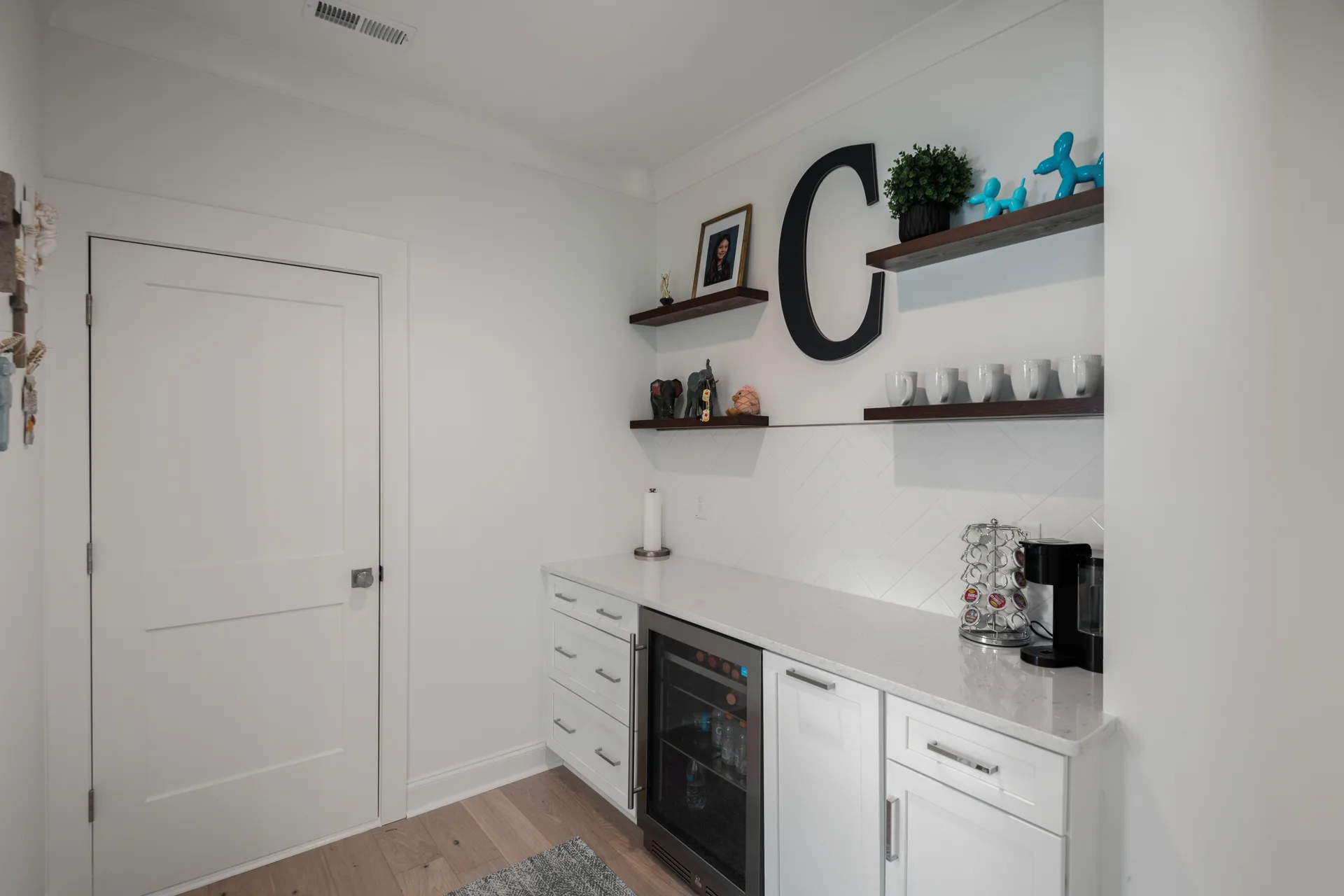 Beverage area with mini-fridge and custom drawers