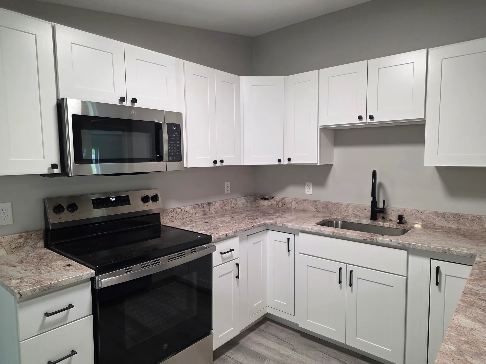 Modern farmhouse kitchen with white shaker cabinets
