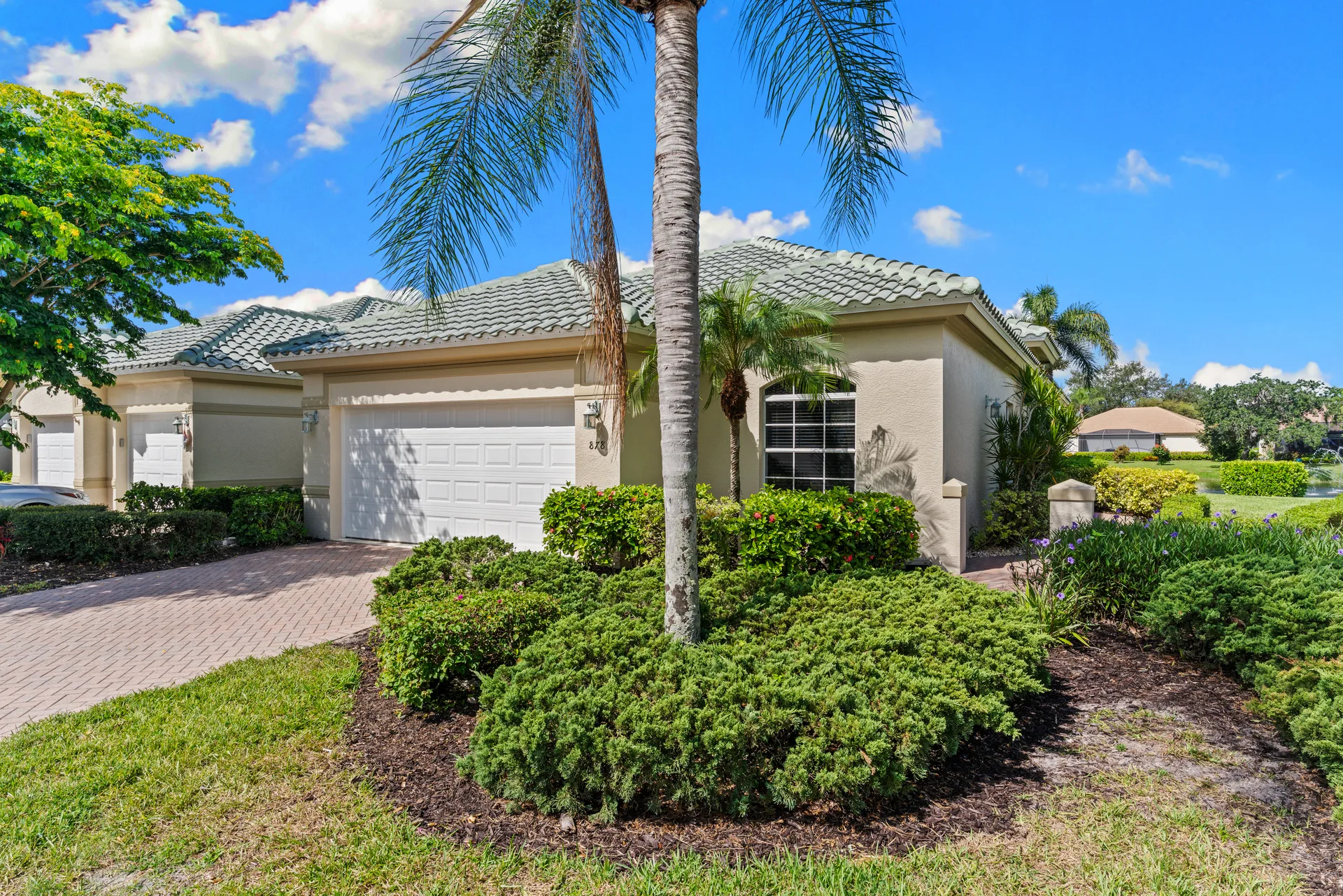 Lake view from exterior of 878 Vistana Circle Naples Florida