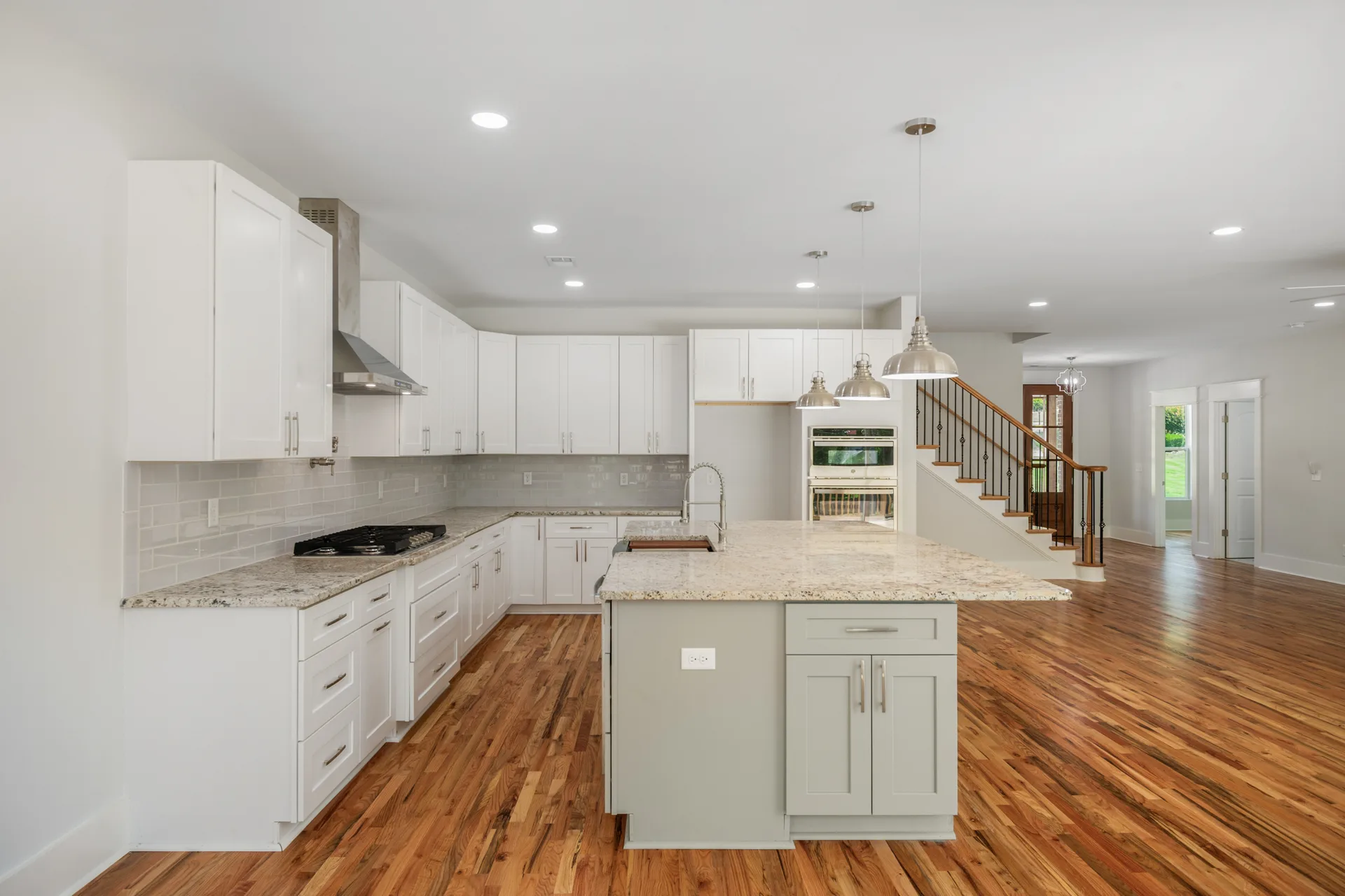 Farmhouse kitchen with gas cooktop and wall oven