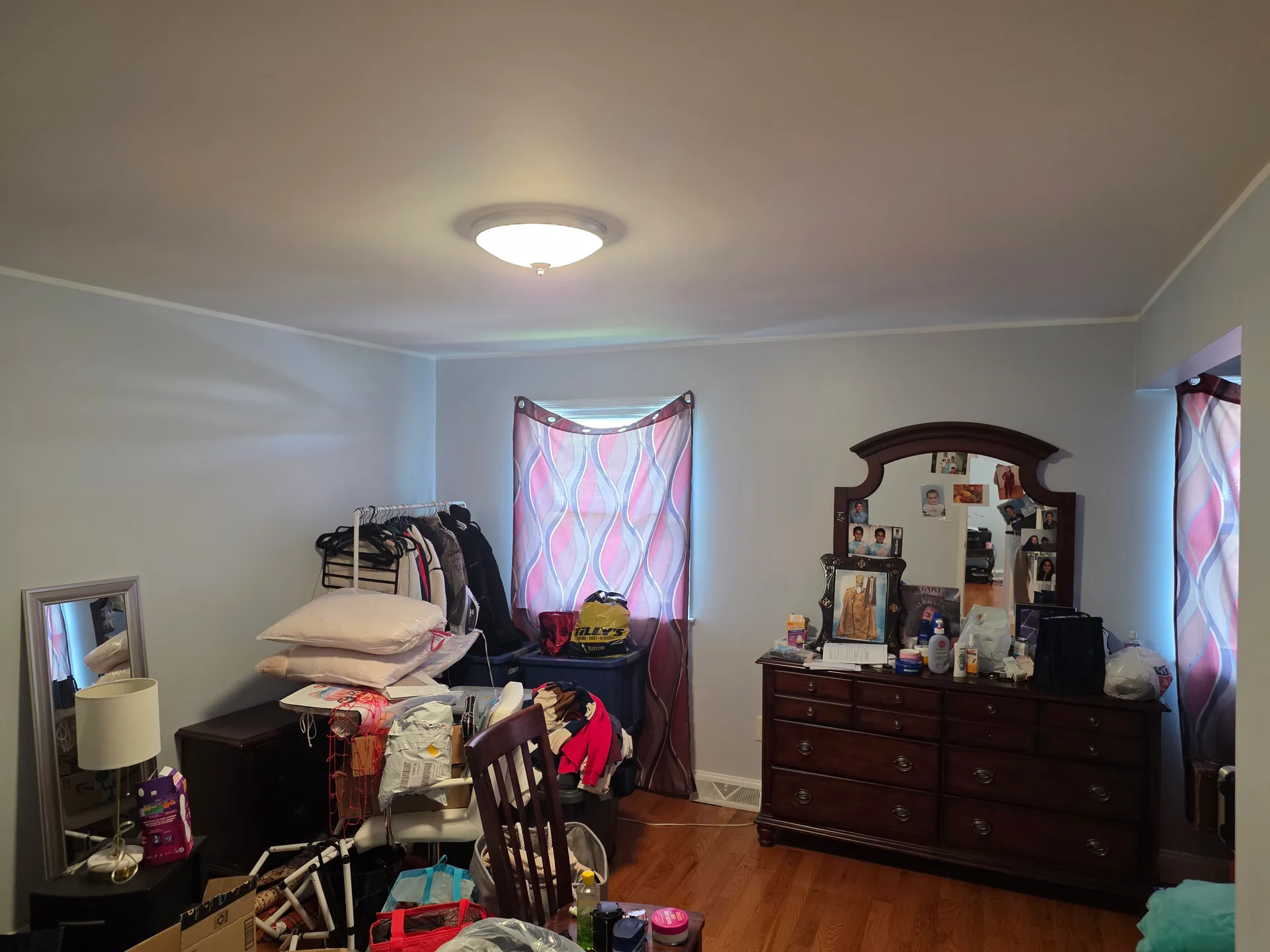 Primary bedroom with hardwood floors