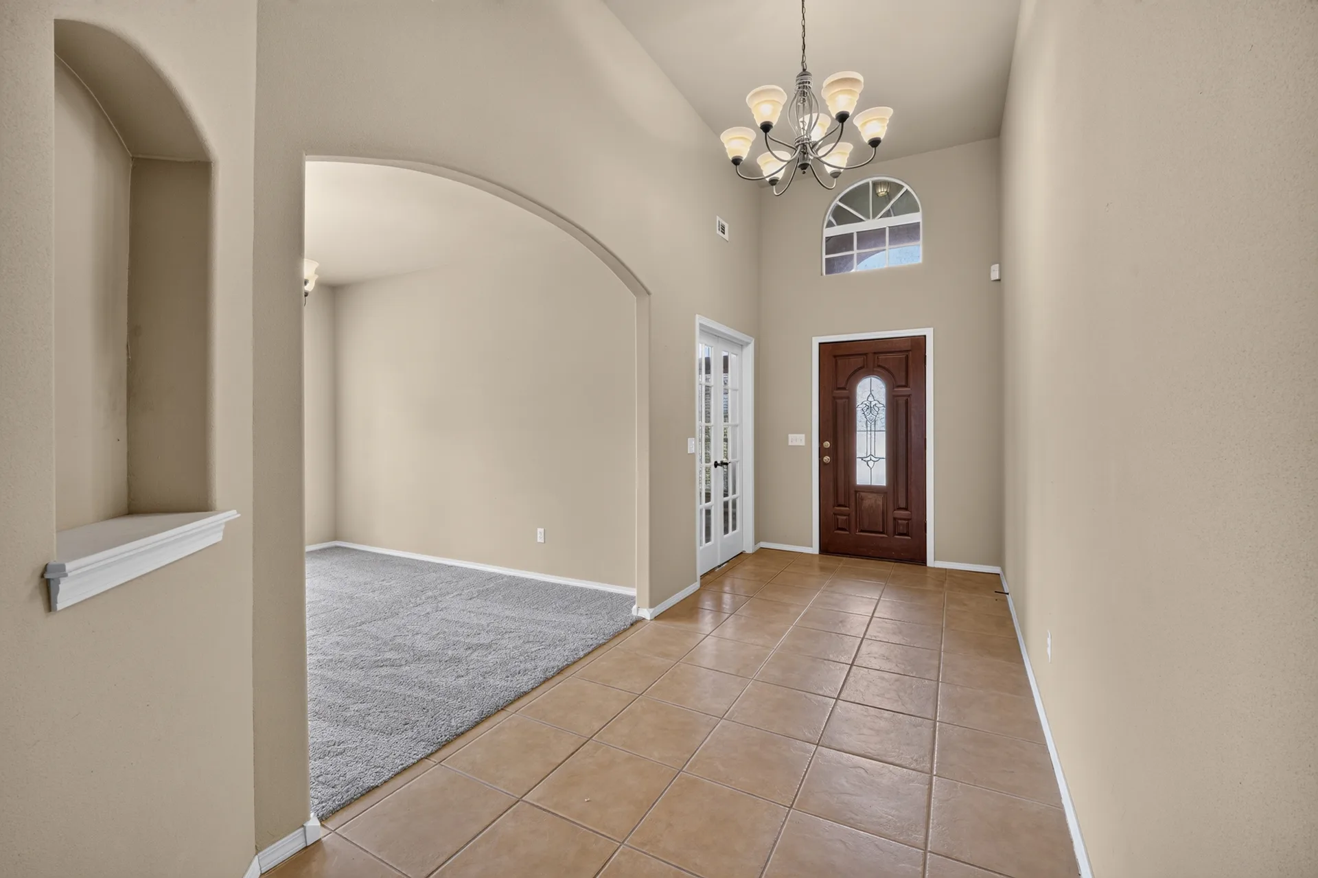 Foyer with arched transom light